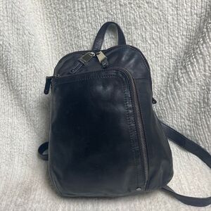 Tignanello Black Leather small Backpack with silver tone hardwares.